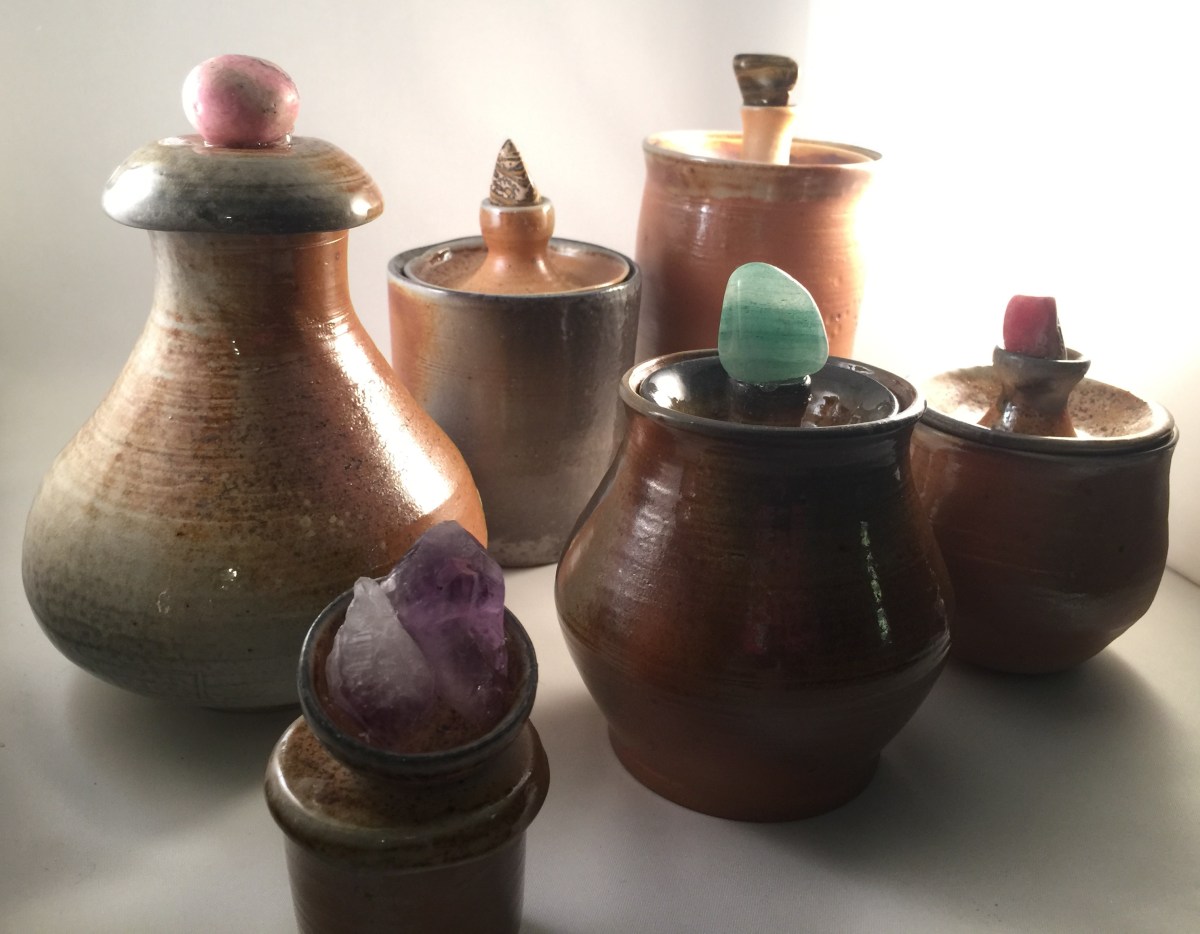 hand-crafted pottery with crystals and stones